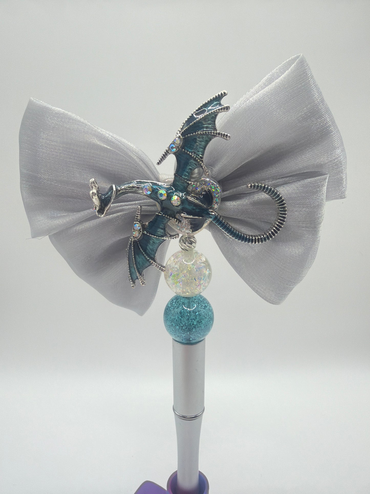 Dragon pen with grey bow