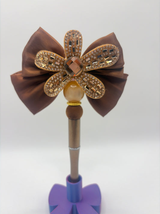 Brown flower with bow