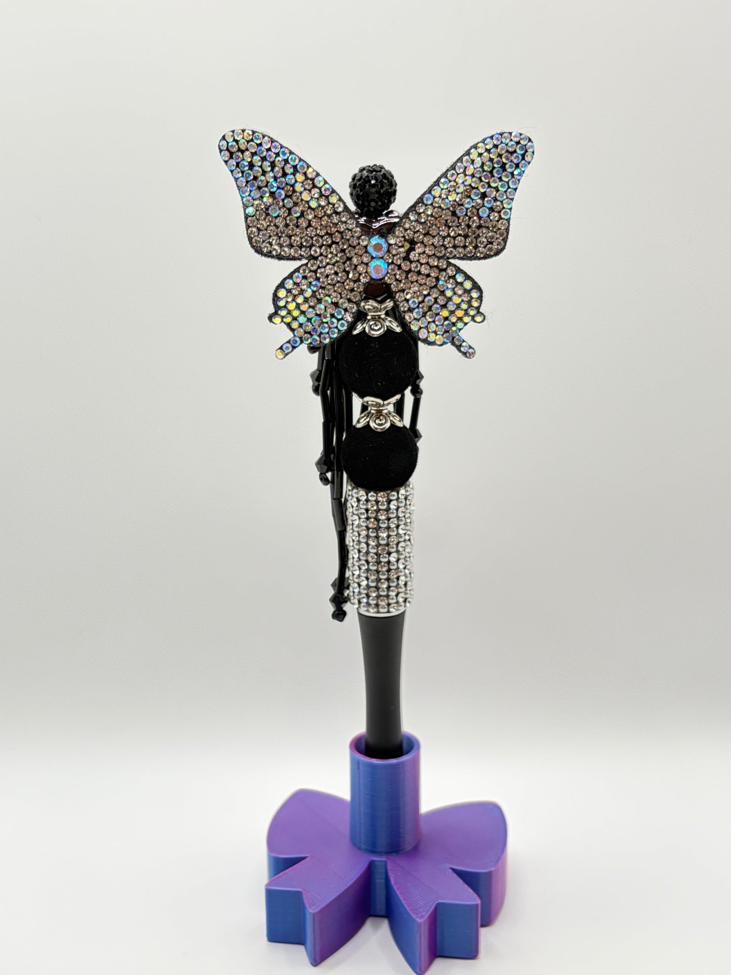 Black rhinestone butterfly with dangles.